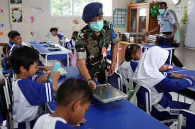 Image for Analysis-Indonesia's new leader expands military's role in test of fragile democracy