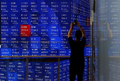 Image for Stocks, yields edge higher; Powell says economy still in good place