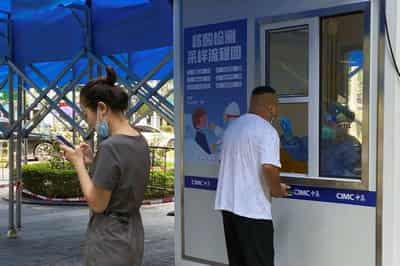 Image for China’s big cities, from Dalian to Shenzhen, ramp up COVID curbs