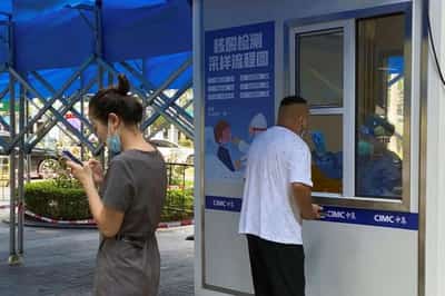 Image for China’s big cities, from Dalian to Shenzhen, ramp up COVID curbs
