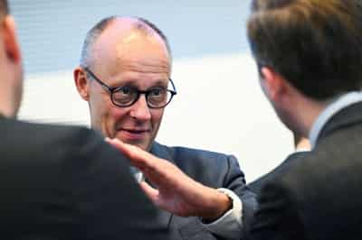 Image for Merz vows electricity tax cut for all consumers to close 'credibility gap'