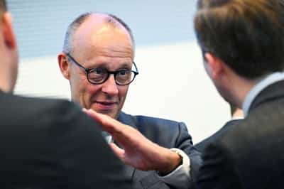 Image for Merz vows electricity tax cut for all consumers to close 'credibility gap'