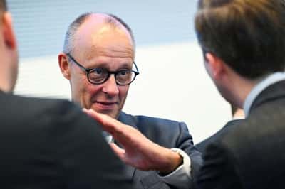 Image for Merz vows electricity tax cut for all consumers to close 'credibility gap'