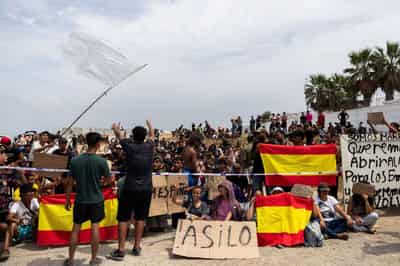 Image for In Spain's Ceuta, hundreds of migrants stage protest and demand asylum