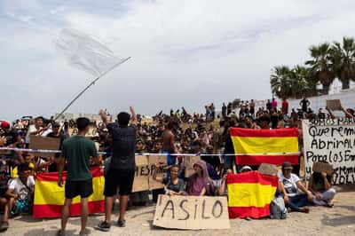 Image for In Spain's Ceuta, hundreds of migrants stage protest and demand asylum