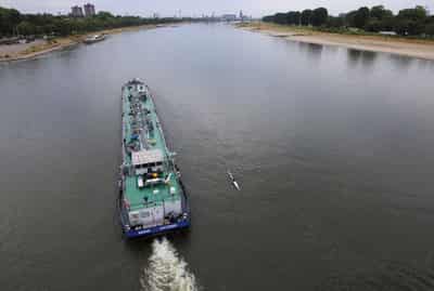 Image for Water levels on river Rhine in Germany rising after rain but vessels still part loaded
