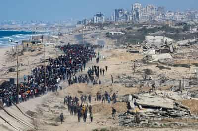 Image for Gazans' joy tempered by shock as they eye remnants of homes after ceasefire