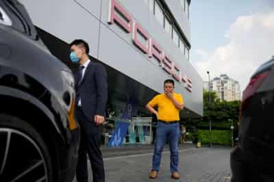 Image for Unpaid by Evergrande, supplier sells Porsche and home to rescue his business