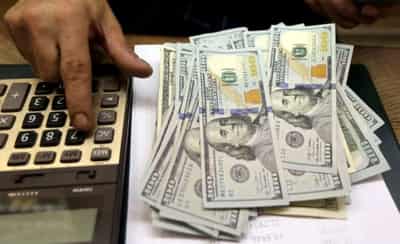 Image for Dollar hovers near one-month low, set for worst week since May
