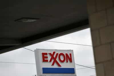 Image for Exxon loses board seats to activist hedge fund in landmark climate vote