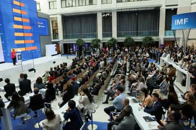 Image for IMF slashes global outlook as White House says trade talks pick up pace