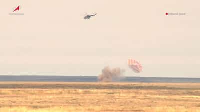 Image for Spacecraft brings Russians, American back to earth, Russia's space agency says