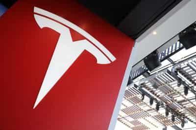 Image for Tesla profit tops target; Musk says high prices could hurt demand