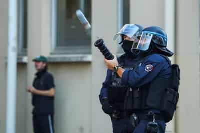 Image for France suspends use of stun grenades to police student protests