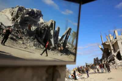 Image for Palestinian rescue workers begin search for people under rubble on day two of ceasefire