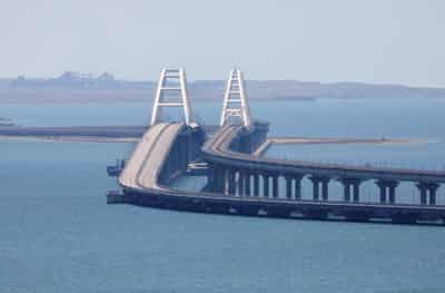 Image for Ukraine says it hit Russia's bridge to Crimea with underwater explosives