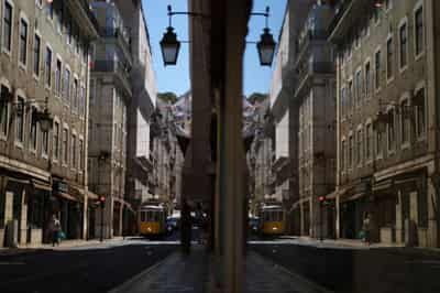 Image for Portugal imposes stricter rules as COVID surge threatens summer tourism