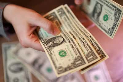 Image for Dollar near one-week high as hot U.S. inflation fans Fed hike bets, peace talks stall
