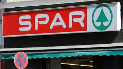 Image for Retailers turn off lights, cut opening hours to save energy