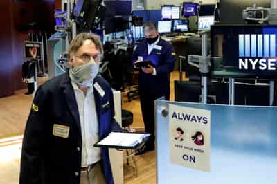 Image for Stocks hit record highs, bitcoin surges after Tesla news