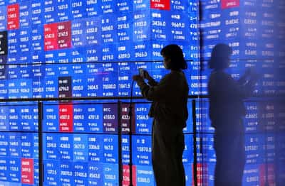 Image for Asian shares climb ahead of US jobs data, Fed's Waller soothes bonds
