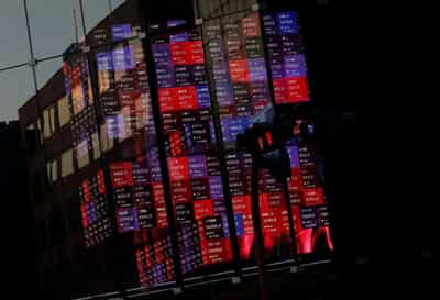 Image for Asian stocks steady, Japan, China central banks interrupt dollar’s ascent