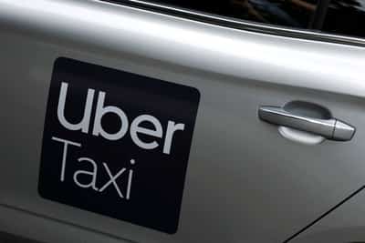 Image for Uber plans 10% workforce cut to trim management layers