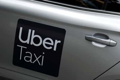 Image for Uber plans 10% workforce cut to trim management layers