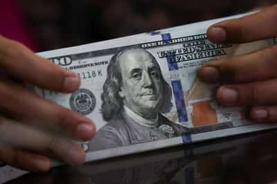 Image for Dollar lower as investors reignite 'Sell America' trade