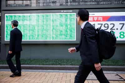 Image for Stocks hit fresh record high but US dollar weakens as Fed rate cut expectations gain momentum