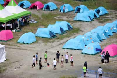 Image for After heatwave, looming typhoon forces scouts to evacuate South Korea campsite