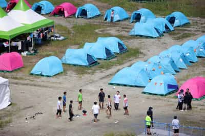 Image for After heatwave, looming typhoon forces scouts to evacuate South Korea campsite
