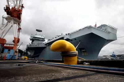 Image for Britain shows off Queen Elizabeth aircraft carrier to anxious Japan