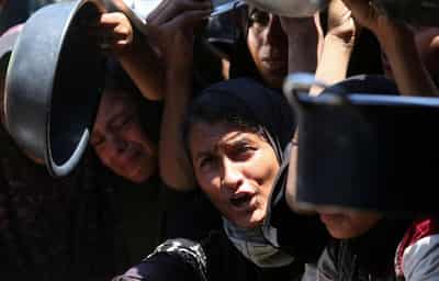 Image for More Gazans die seeking aid and from hunger; burial shrouds in short supply