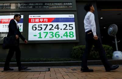 Image for Asia stocks waver as yen surges, Iran warns of retaliation