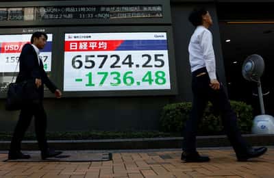 Image for Asia stocks waver as yen surges, Iran warns of retaliation