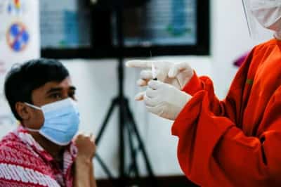 Image for Chickens, cows, apartments offered up in Asia&#8217;s vaccination lucky draws