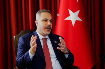 Image for Turkey, US will find way of removing CAATSA sanctions 'very soon', Turkish FM says