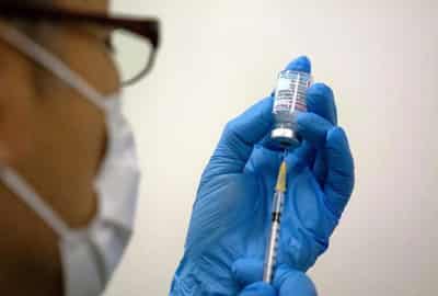 Image for Japan health minister says Okinawa vaccine contaminants likely from needle stick