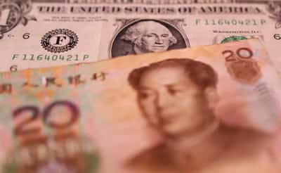 Image for Yuan slides after PBOC, dollar little changed on MLK Day