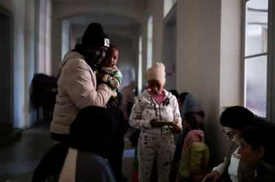 Image for Refugees, migrants in Lebanon find rare sanctuary from Israeli strikes in Beirut church