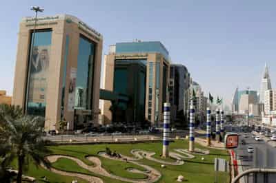 Image for Analysis: With stick and carrot, Saudi starts winning over firms in regional race
