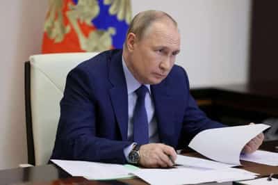 Image for Putin clings to semblance of normality as his war grinds on
