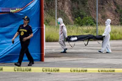 Image for Philippines begins identifying victims from ferry fire as dozens still missing