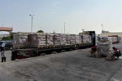 Image for Turned back from Gaza, aid shipments languish in warehouses, on roadsides