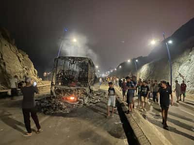 Image for Sleepless night near border of Spain's Ceuta as migrants torch vehicles