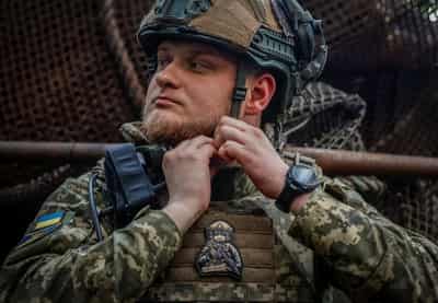 Image for Under fire on front line, Ukrainian soldiers doubt talks will bring peace