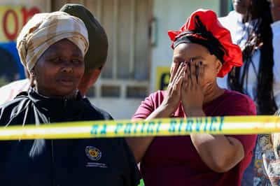 Image for South African police hunt killers after 27 gunned down in two separate shootings