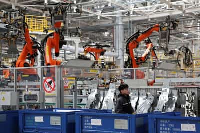 Image for China's factory activity returns to growth in September amid AI boom