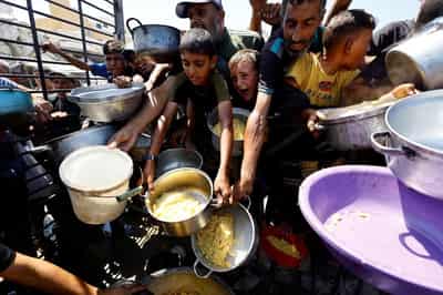 Image for Gaza no longer in famine after aid access improves, hunger monitor says